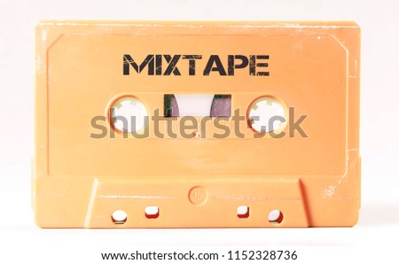 A vintage cassette tape from the 1980s era (obsolete music technology) with the text Mixtape printed over it (my addition, not in the original image). Color: cream, sand. White background.
