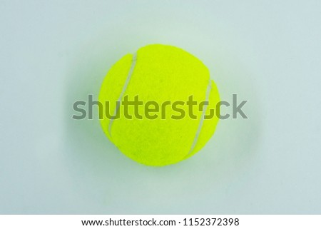 
yellow fluorescent tennis ball