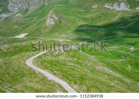A picturesque road among the mountains in the National Park Durmitor.