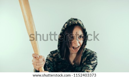 Young cute girl with baseball bat, Girl with a bat. girl or criminal woman, holding baseball bat in hand.  Sport and training