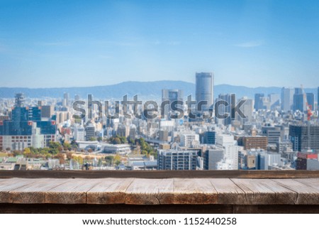 Business concept - Wood table top on blur city scape background, Tokyo, Japan. Can be used for display or montage your products or design key visual layout.