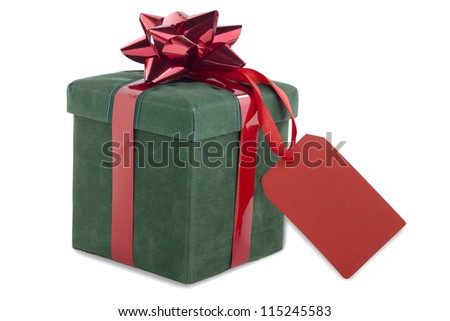 Close-up shot of green gift box tied with bow with red empty placard.