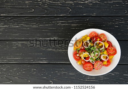 Summer salad of tomatoes, peppers, blue onions, olive oil and oregano. Fitness menu. Healthy eating. Vegan food. Top view. 