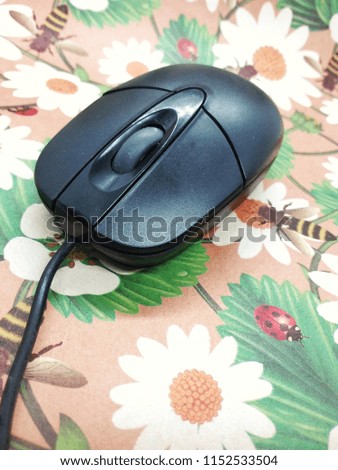 Mouse computer on colorful background. Close up and selected focus.