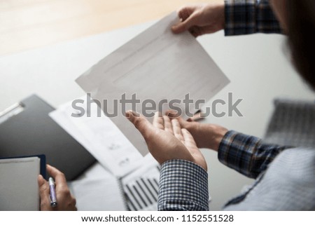3 people work in the office, talking to, and address the issues of the company, smile and sign documents
