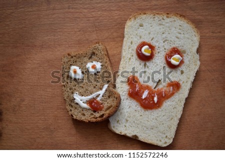 Sandwich on Halloween with a smile from ketchup and mayonnaise Royalty-Free Stock Photo #1152572246