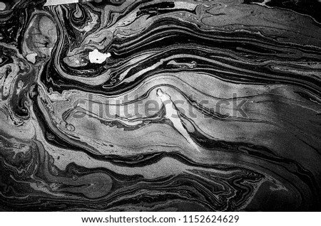 Suminagashi – the ancient art of Japanese marbling. Paper marbling is a method of aqueous surface design, which can produce patterns similar to smooth marble or other kinds of stone. Natural luxury.  Royalty-Free Stock Photo #1152624629