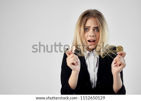 discouraged woman with coins in the hands of depreciating business                            
