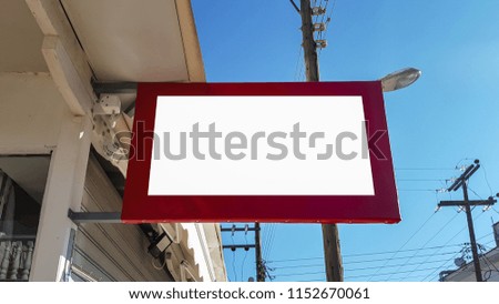 Large Urban City Outdoor White Blank Advertisement Banner Sign Mock Up Hanging In Red Frame.Isolated Template Clipping Path