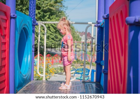 Concept of children life. Little child having fun in a beach. Happy child playing in the nature . Kid having fun outdoors. Summer vacation and healthy lifestyle