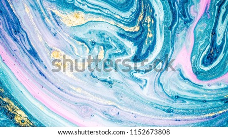 Abstract ocean- ART. Natural Luxury. Style incorporates the swirls of marble or the ripples of agate. Very beautiful blue paint with the addition of gold powder. Royalty-Free Stock Photo #1152673808
