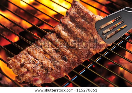 Grilled pork ribs on the grill. Royalty-Free Stock Photo #115270861