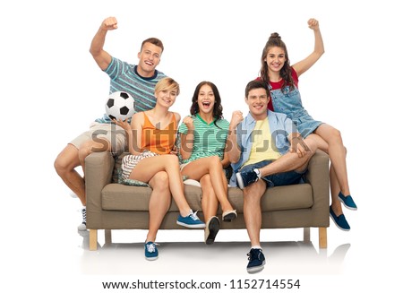 entertainment, leisure and people concept - group of happy smiling friends or football fans with soccer ball sitting on sofa over white background