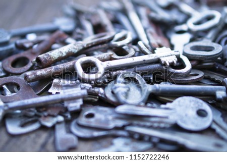 Collection of a variety of old keys. secret behind the wooden doors. Creative decorative background for design. Retro style