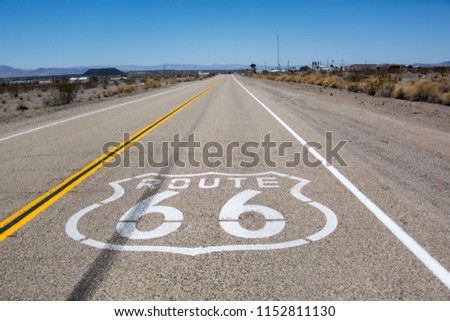 Route 66 sign on the road Royalty-Free Stock Photo #1152811130