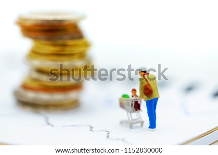Miniatrue people: Shoppers with shopping cart investment trading on a stock exchange. Finance, investment and business concept.