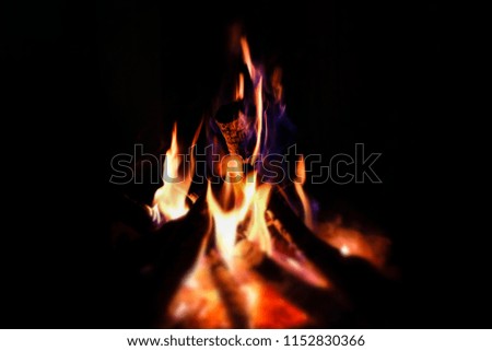 Fire flames close up over black background