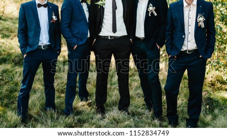 Wedding portrait groomsmen and groom. Young friends groomsman posing for camera. Cheerful friends outdoors. Wedding day. Royalty-Free Stock Photo #1152834749