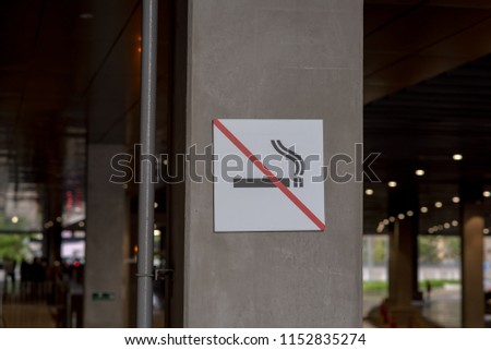 No smoking signs Concrete poles.