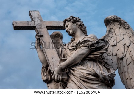 Bernini's marble statue of angel with cross from the Sant'Angelo Bridge in  Royalty-Free Stock Photo #1152886904