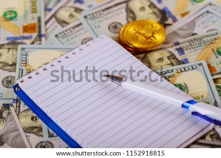 Money banknote US dollar and coins put on wooden table with silver pen, notebook and saving jar on background,
