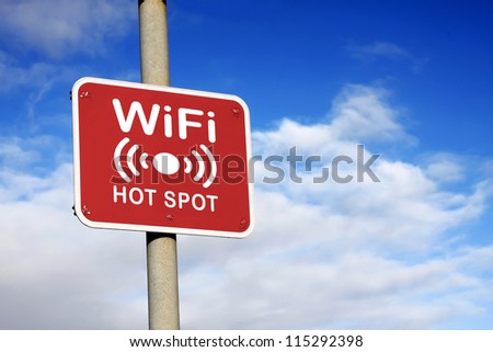 WiFi hotspot sign against a blue sky