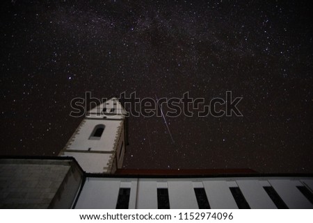 church with milkyway and meteoroid