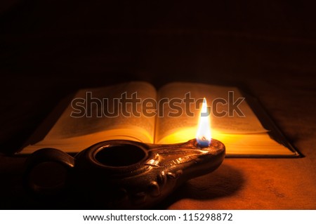 Oil lamp and Bible Royalty-Free Stock Photo #115298872