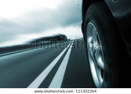 Car ride on road - motion blur Royalty-Free Stock Photo #115302364