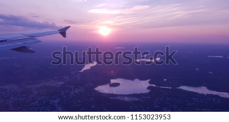 Aerial view of the city of Boston during the sunset from the window of a plane. Wing