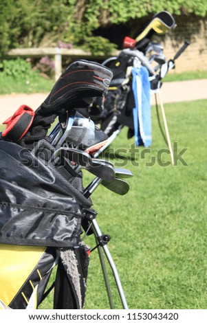  golf clubs on a putting Green