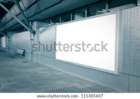 Blank billboard with empty copy space (path in the image) on the street in blue tune