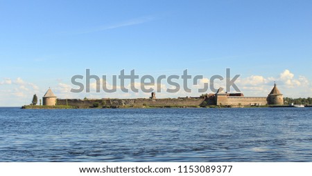 Photo of an ancient fortress on the island. Castle on the sea. picture of summer landscape
