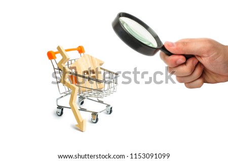 A supermarket cart with a small house and a wooden arrow down on a white background. Search. fall in property prices. Decrease in demand for housing in the primary market. The fall in prices. banner