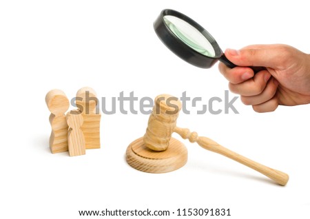Figures of the family and the hammer of the judge. Concept of judicial system for human rights. Family matters, the adoption of a child. Weddings and divorce. Deprivation of parental rights. study Royalty-Free Stock Photo #1153091831