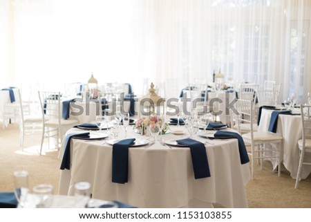 Indoor wedding reception setup tables Royalty-Free Stock Photo #1153103855
