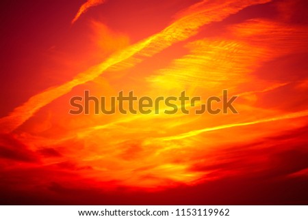 Red dramatic background. Fiery red sunset sky. Red clouds sky. Cataclysm concept. Scenic Wallpaper or Web banner With Copy Space.
