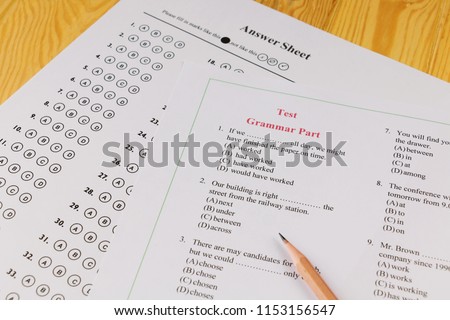 English multiple choice test on table Royalty-Free Stock Photo #1153156547