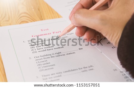 English multiple choice test on table  Royalty-Free Stock Photo #1153157051