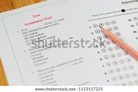 English multiple choice test on table Royalty-Free Stock Photo #1153157225