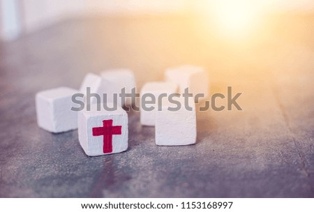 Square objects placed on the floor with a cross in the middle.