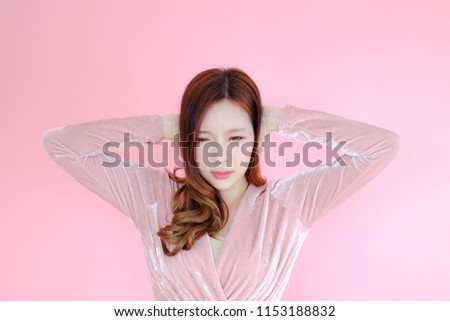 Portrait beautiful asian woman on pink background, unhappy expressions and emotions