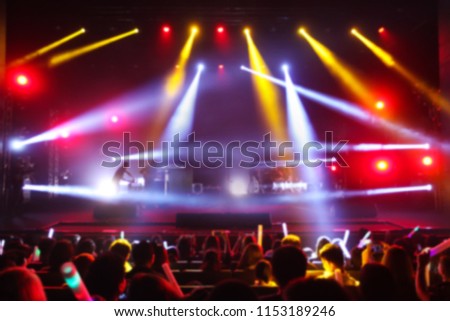 Blurry background of Rock Concert with concert audience.