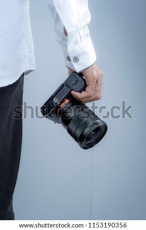 professional photographer with camera in studio