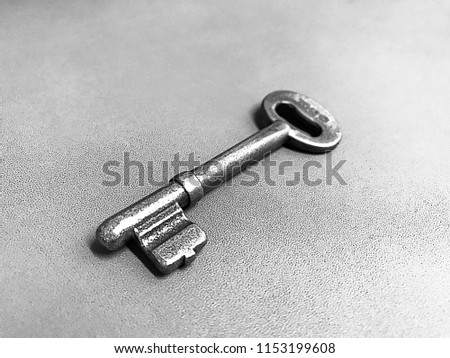 Old key on grey background with copy space a color of vintage tone selective and soft focus