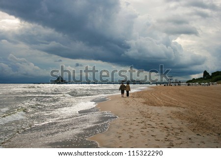 Dark Rain Clouds over Baltic Sea Beach of Heringsdorf, Usedom Islan, Germany Royalty-Free Stock Photo #115322290