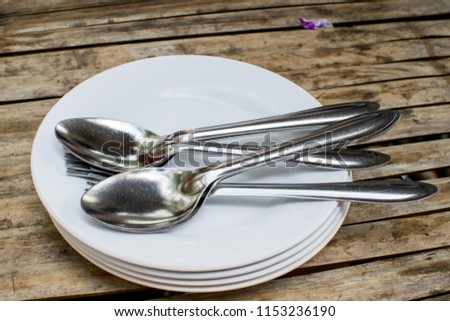 Spoon plate and spoon on dining table