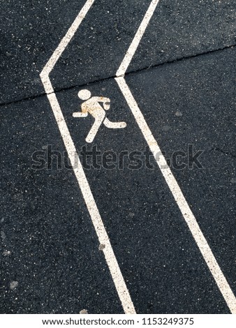 A walking lane with human walking sign on the road