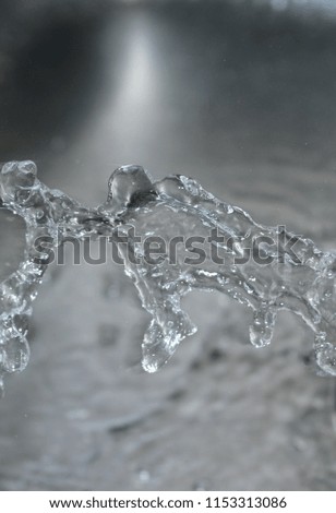 A close-up & detailed photograph of flowing water in motion. This photo was taken in Brisbane, Australia. 