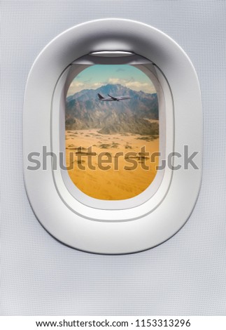 Highland landscape with airplane above the mountainous peaks in African desert.